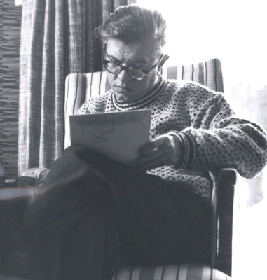 Photograph of Hoyle writing, c. 1965