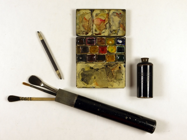 Paint tin and brushes