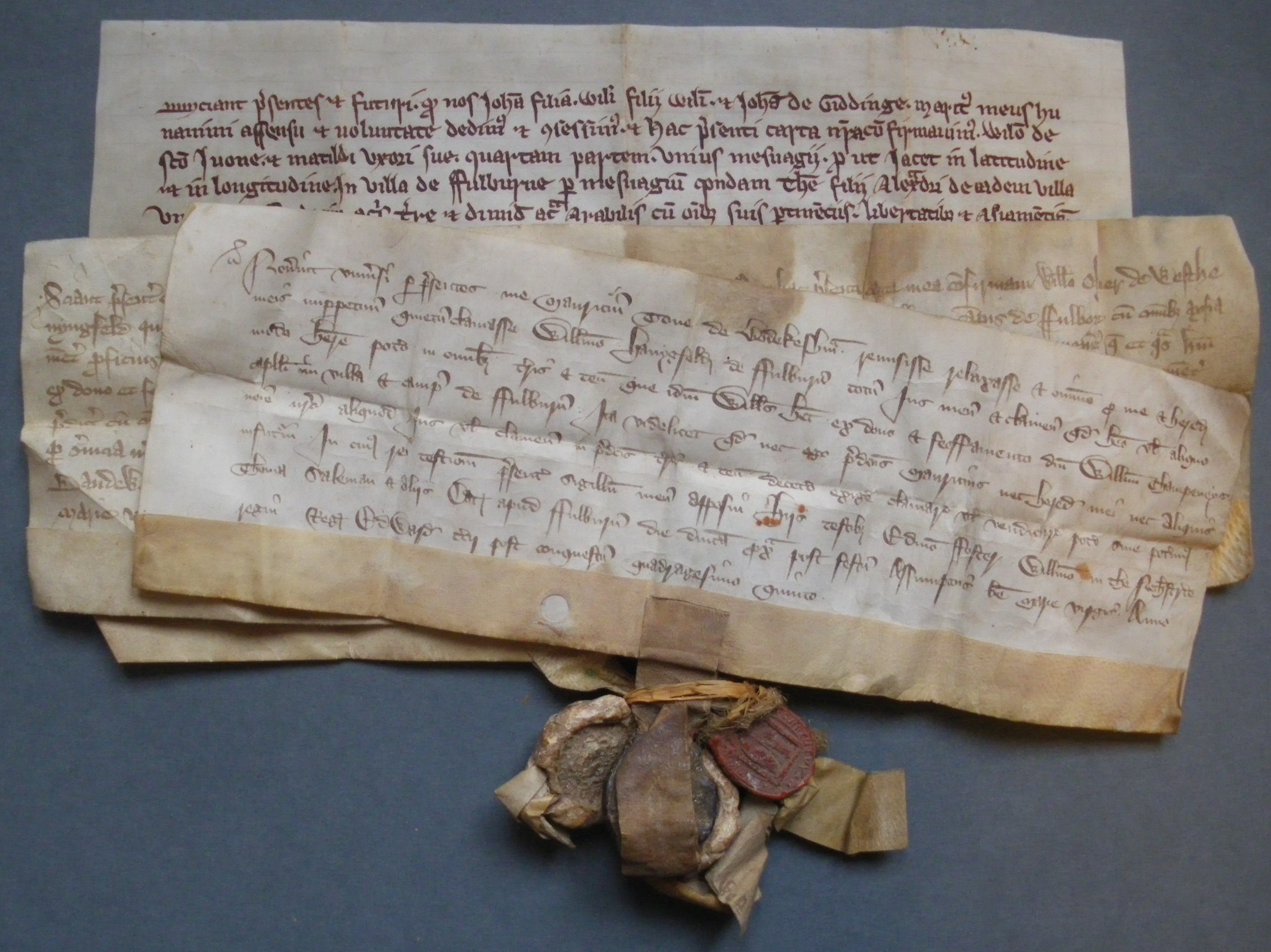 3 documents, including grant of land by Johanna and John de Giddinge