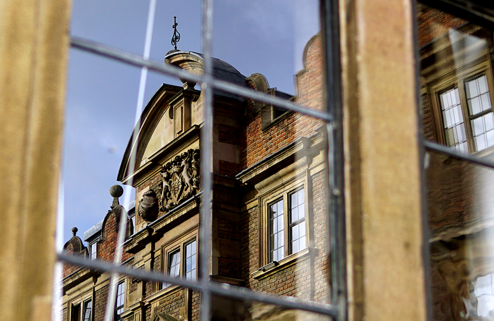 Third Court buildings seen in a window reflection