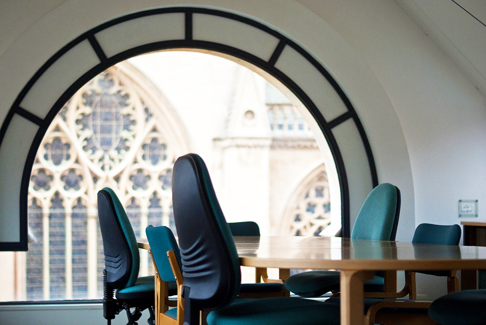 A view of the Chapel through a window in the library