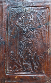 Binding detail showing St Michael slaying the dragon 