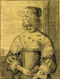 An immodest woman, with patches added by hand.