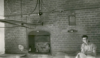 Bill Daish in front of College bakehouse oven by Ken North (1930s)