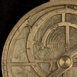 Part of the front of a 15th-century French Astrolabe, Wh.0999, showing the rete and the plate beneath it. Image © Whipple Museum of the History of Science, University of Cambridge.