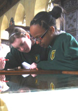 Year 8 students looking at Mercator's Atlas(1613) in the Old Library