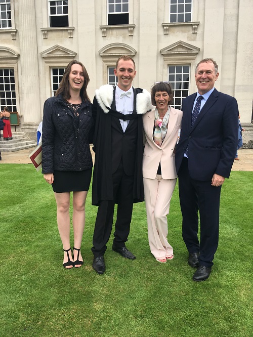 Sam with his family at his belated graduation ceremony in 2019