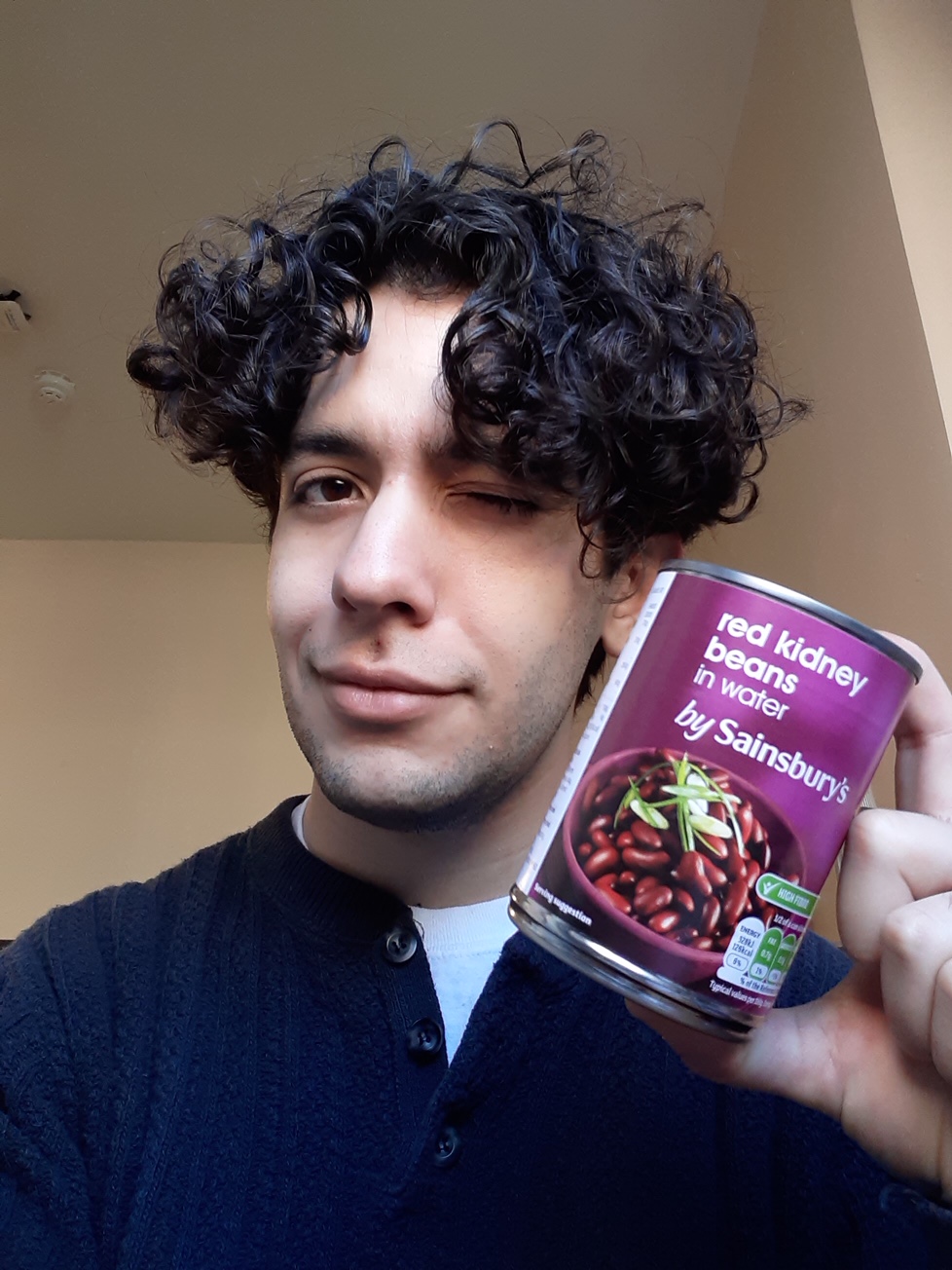 Alejandro with a tin of food