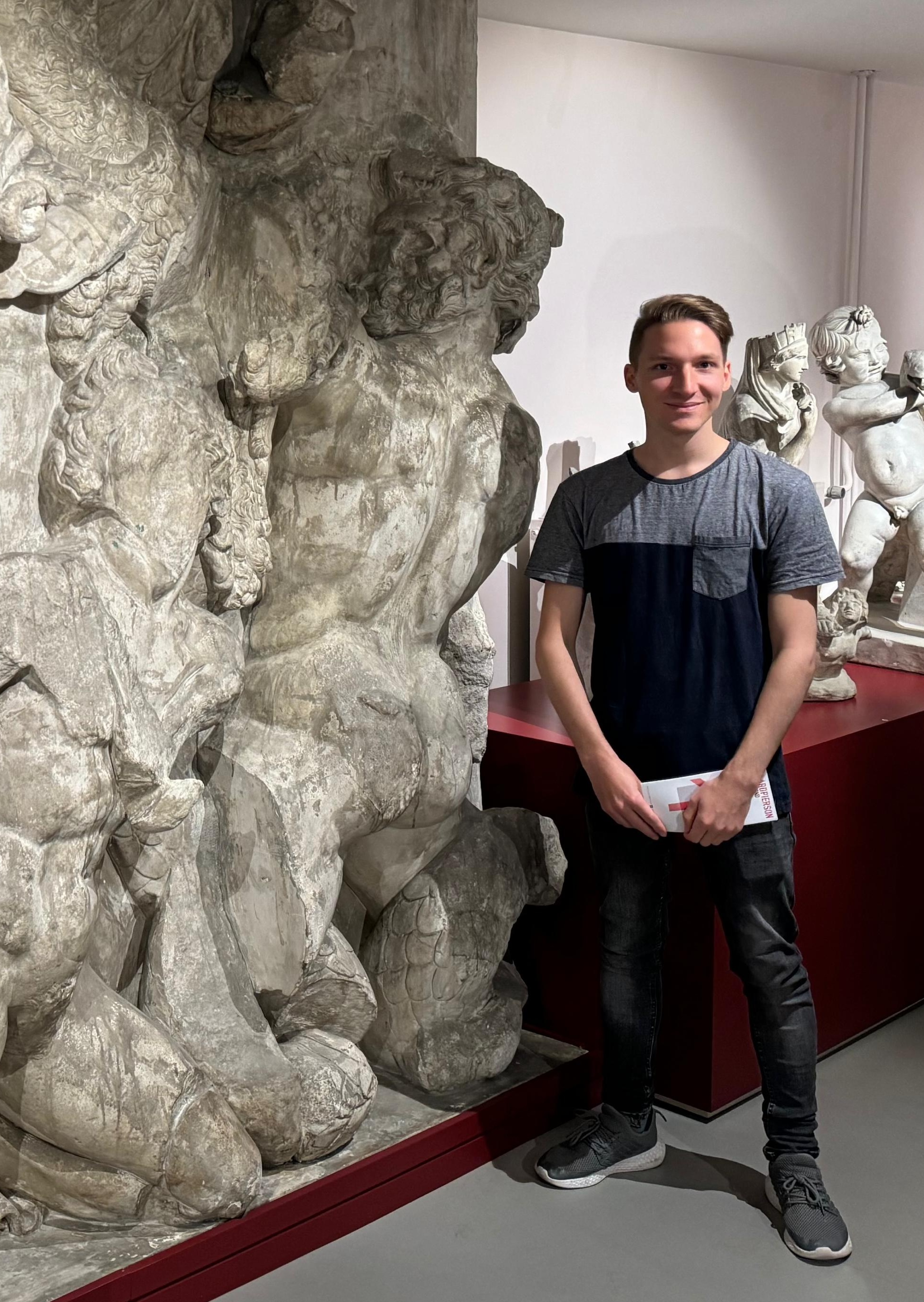 Aivin with a copy of a Porphyrion relief