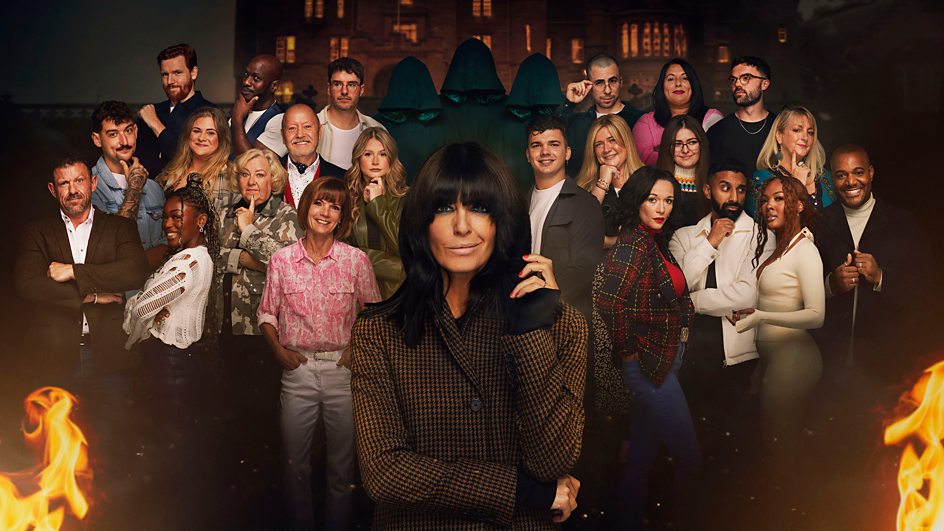 TV presenter Claudia Winkleman stands in front of 22 contestants from season 2 of the BBC One TV show The Traitors