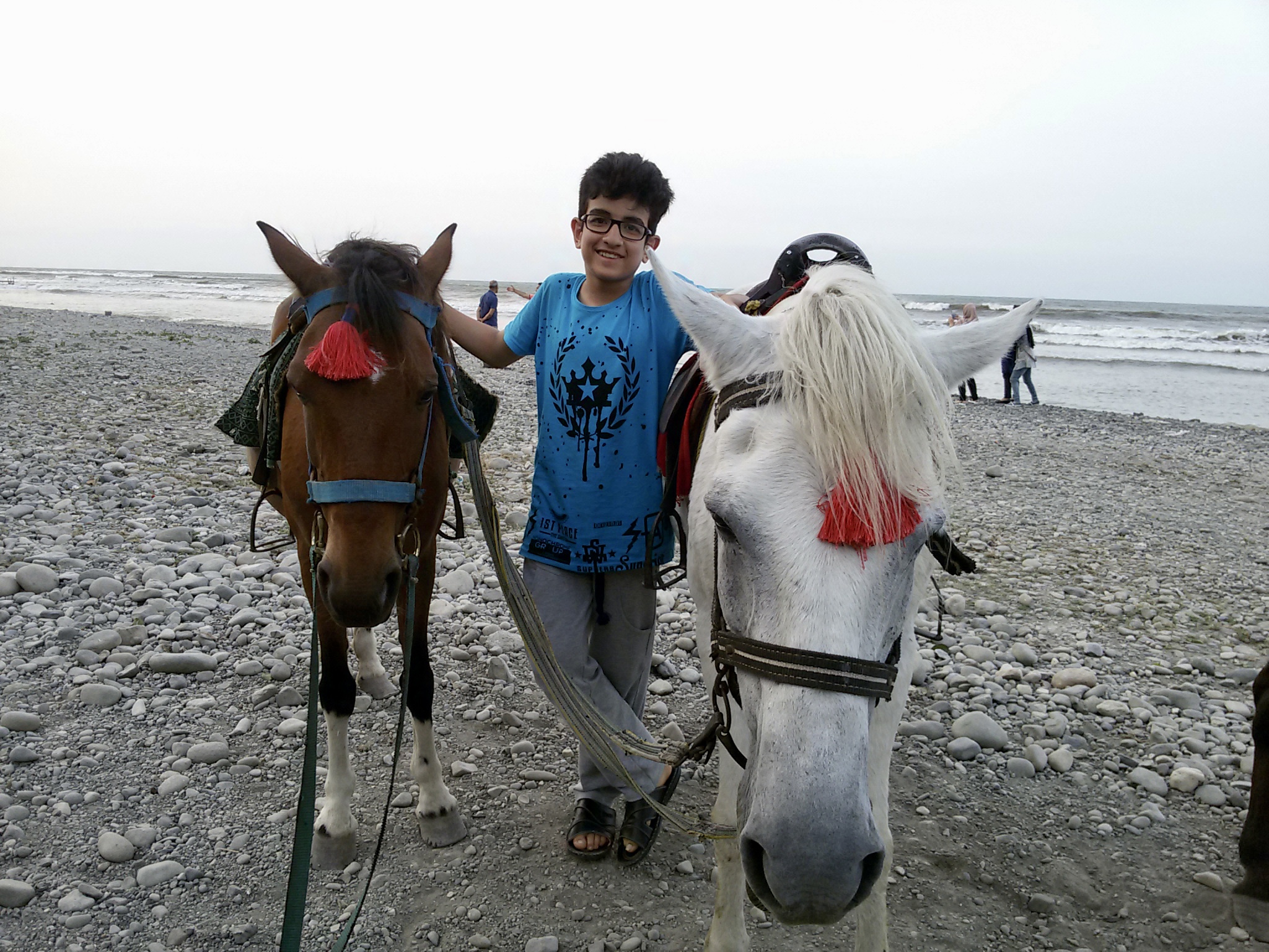 Amir on the beach aged 14