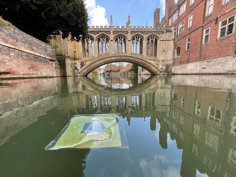A floating artificial leaf being tested on the River Cam in front of the Bridge of Sighs at St John's College. Top photo: The thin perovskite-BIVO artificial leaf set up to show how the leaves would work on a large scale.
