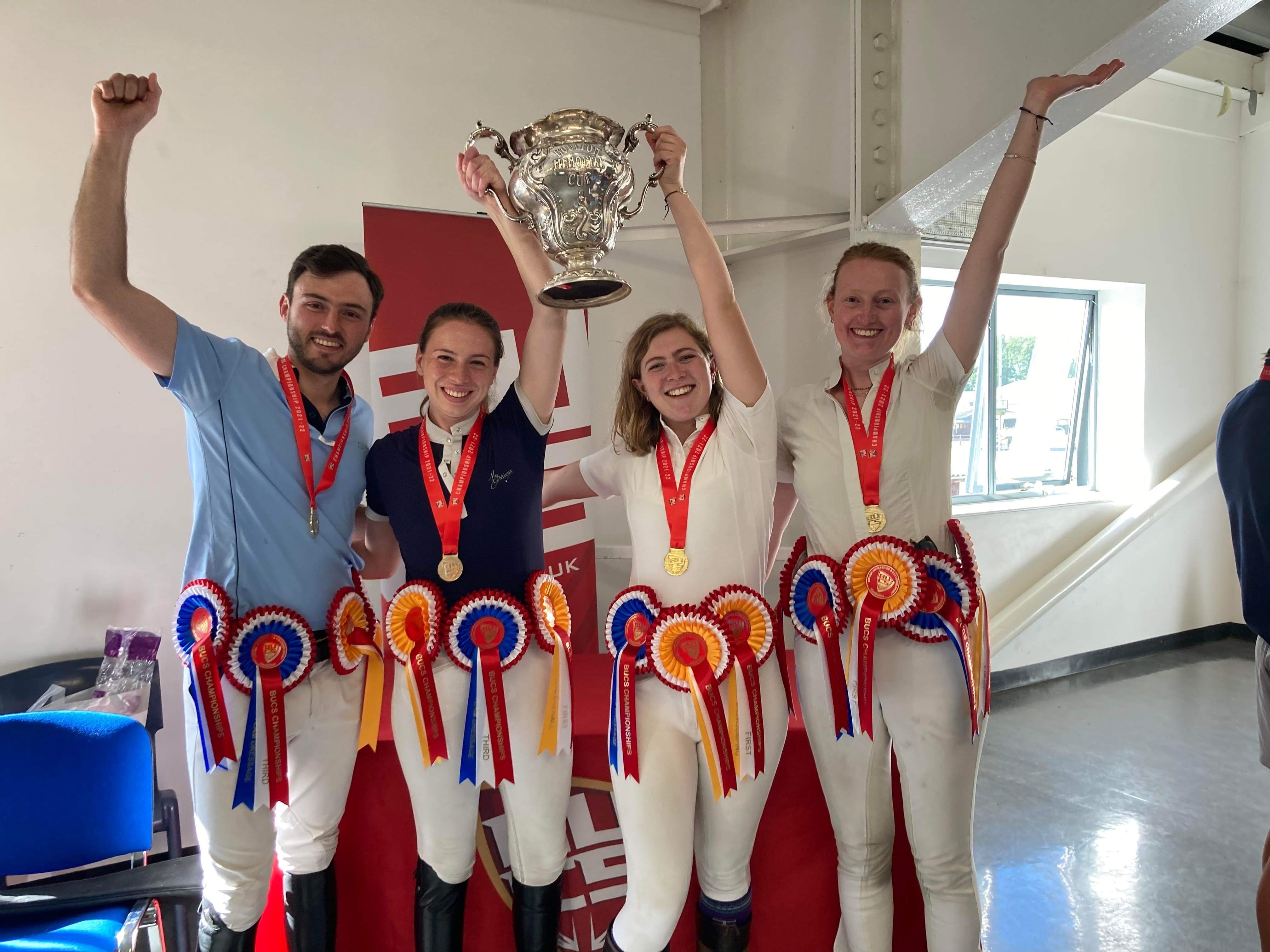 Chloe (centre, left) and Maaike (centre, right) are pictured holding their trophy aloft with team mates Lydia Collas and Manuel Fernandez at the championships.  