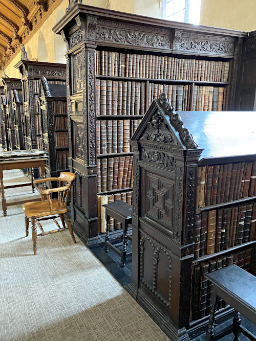 Photograph of lectern-top shelves at original height.