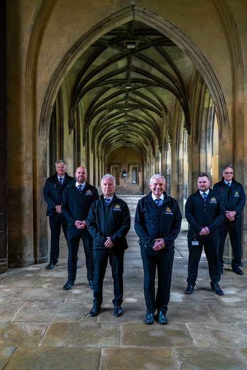 Some of the Porters in the Cloisters, Steve Poppitt in the front.
