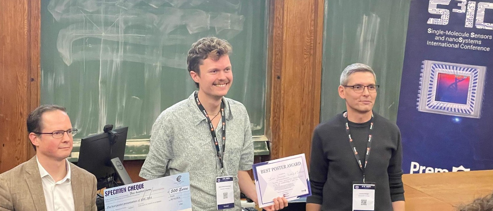 Simon pictured centre with his award
