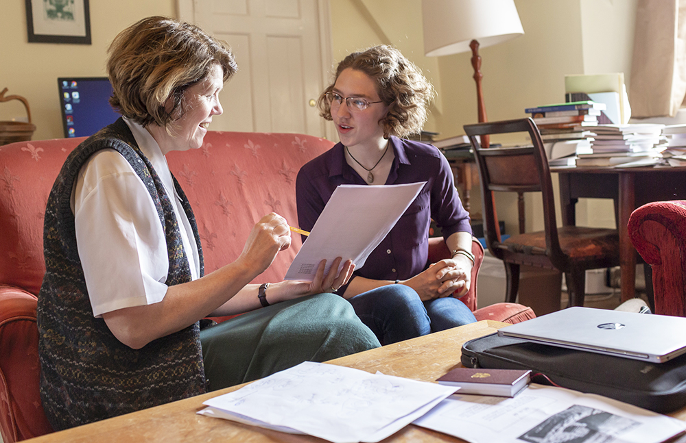 A student speaking with an academic