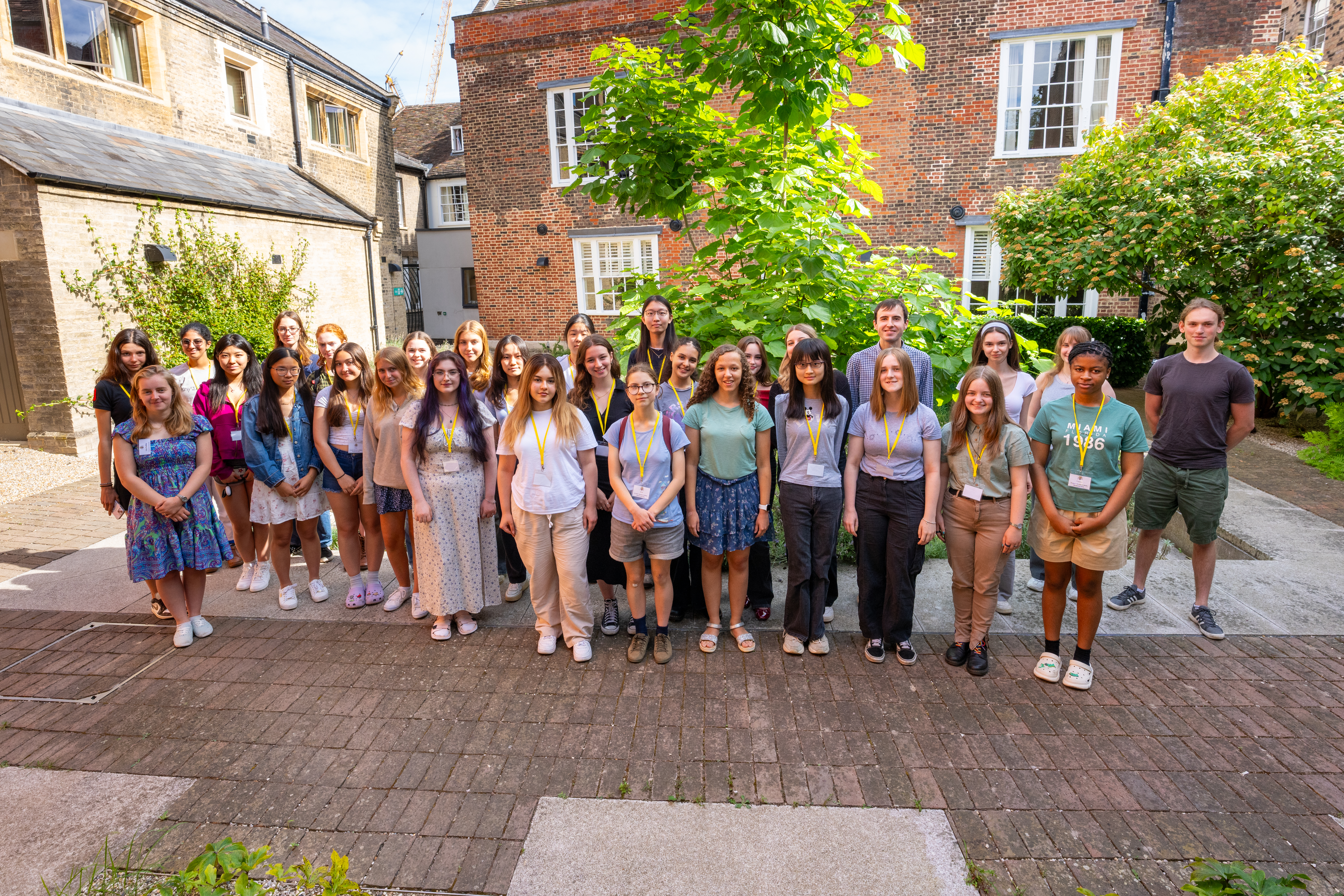 Women in Maths residential pose in Corfield Court, St John's College