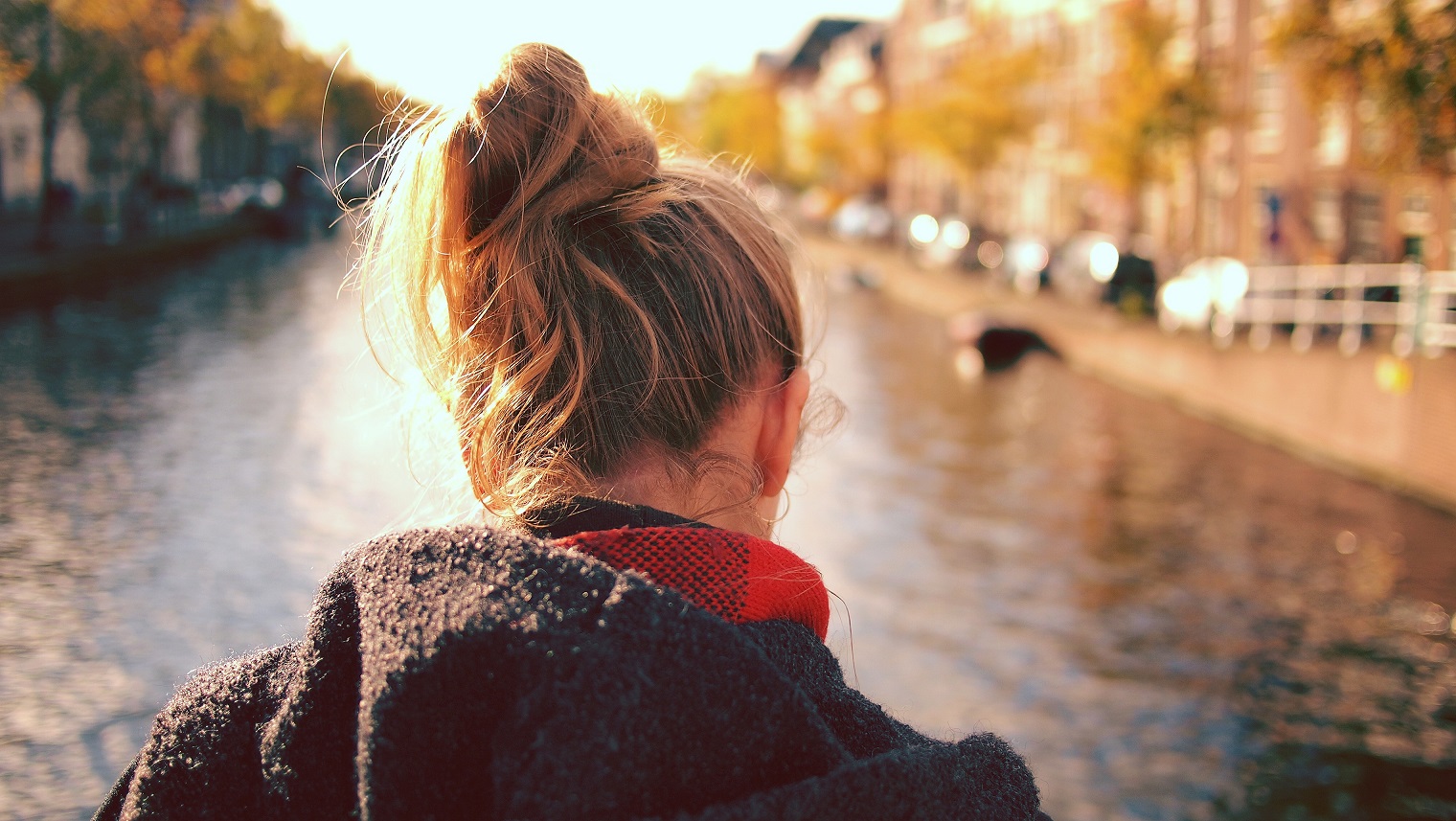 A woman looks out over a river