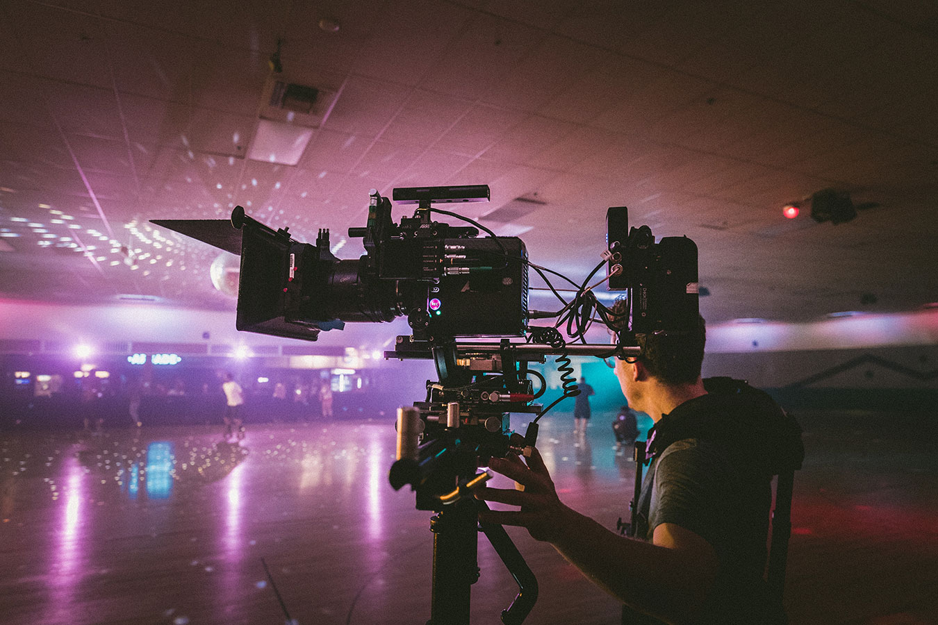 Man films in a roller disco