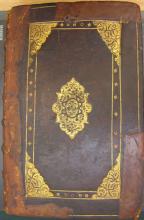 Gold-tooled calfskin binding with date and initials