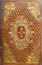 Gold-tooled calfskin binding