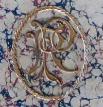 Gilt stamped monogram